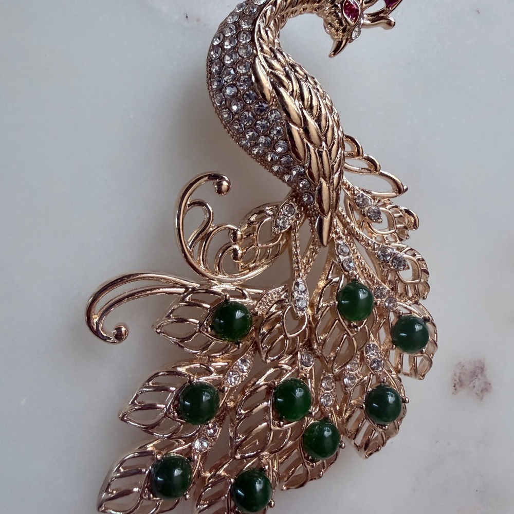 Gold Peacock Brooch with Green Cabochons